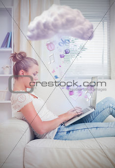 Attractive young woman connecting to cloud computing at home
