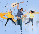 Young man with guitar and two girls jumping for joy