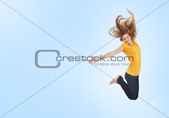 Pretty young woman jumping for joy