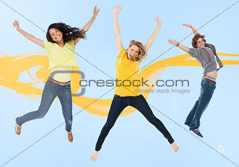 Attractive young man and women jumping for joy