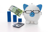 Blue and white piggy bank wearing glasses with calculator