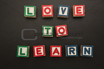 Love to learn message in wooden blocks
