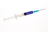 Hypodermic needle with purple liquid