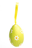 Green wrapped Easter egg with daisy pattern
