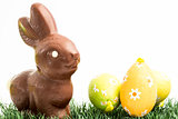 Chocolate bunny rabbit and three easter eggs