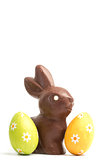 Chocolate bunny with two easter eggs