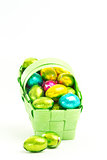 Foil wrapped easter eggs in a basket