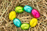 Easter eggs in a circle on straw