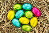 Easter eggs grouped together on straw