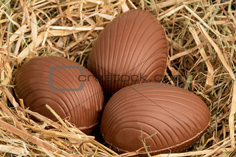 Chocolate easter eggs in straw