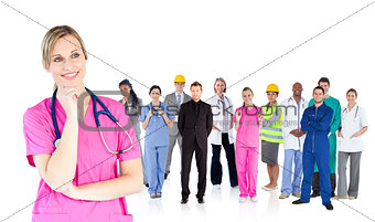 Nurse standing in front of different types of workers