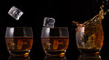 Serial arrangement of ice falling into whiskey glass