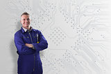 Mechanic standing in front of a circuit board background