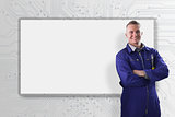 Mechanic standing in front of a white screen