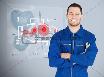 Portrait of a young mechanic with futuristic interface next to him