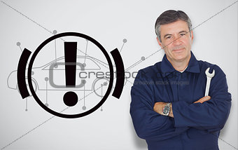 Mature mechanic standing next to hand break signal