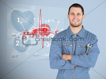 Portrait of a young mechanic next to futuristic interface with diagram