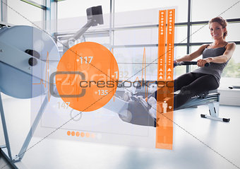 Young girl on rowing machine with futuristic interface showing calories