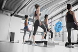 Rear view of women doing exercise with blue futuristic interface
