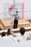 Teacher in front of futuristic interface pointing a student