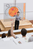 Teacher in front of futuristic interface pointing student