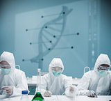 Chemists working in protective suit with futuristic interface showing DNA diagram