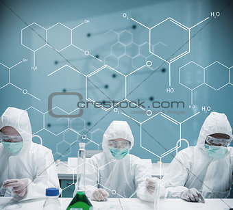 Chemists working in protective suit with futuristic interface showing formula