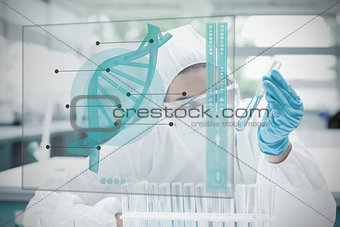 Chemist working cautiously with blue liquid and futuristic interface