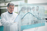 Confident scientist working with tablet and futuristic interface showing graph