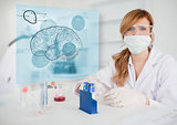 Chemist working in protective suit with futuristic interface showing a brain