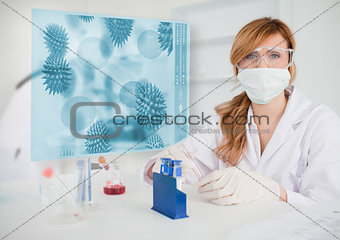 Scientist working in the lab with futuristic interface