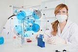 Scientist with protective mask using dna diagram interface