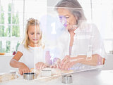 Grandmother and granddaughter baking with white interface