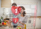 Happy couple making dinner using interface instructions