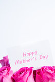 Bouquet of pink roses with happy mothers day card in pink