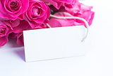 Close up of a beautiful bouquet of roses with a blank card