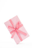 Pretty pink gift on a white background