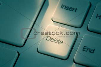 Close up of the delete key in blue