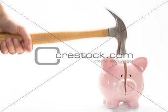 Hammer breaking piggy bank