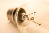 Clear light bulb on white surface