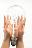 Man holding big light bulb in his hands