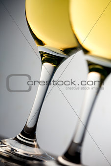 Close up of two white glasses full of white wine