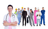 Smiling doctor in front of a team of different workers