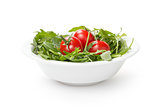 ruccola and tomatoes in white bowl