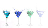 Serial arrangement of blue alcohol splashing in cocktail glass