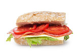 big sandwich with salami cheese and tomato