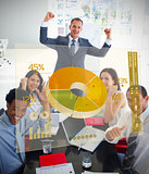 Cheerful business people using yellow pie chart interface