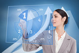 Smiling businesswoman using blue pie chart interface