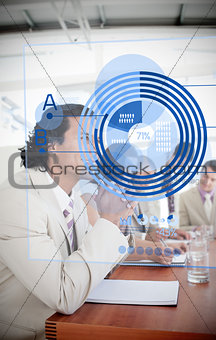 Smiling businessman looking at blue diagram interface