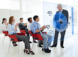 Business people clapping stakeholder standing in front of blue pie chart interface